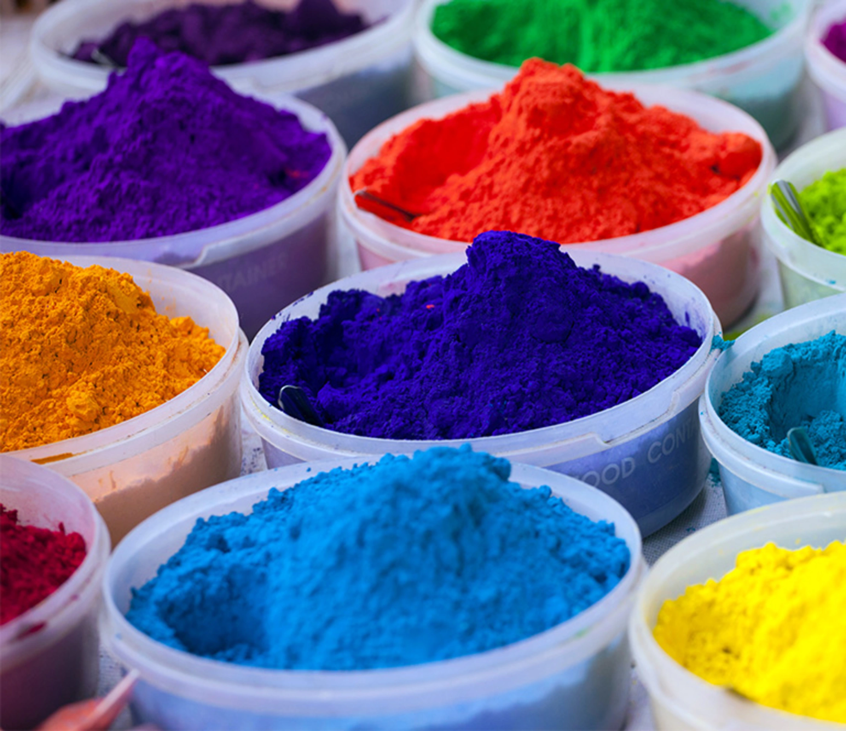 Multicoloured rangoli powders sale for diwali festival.
