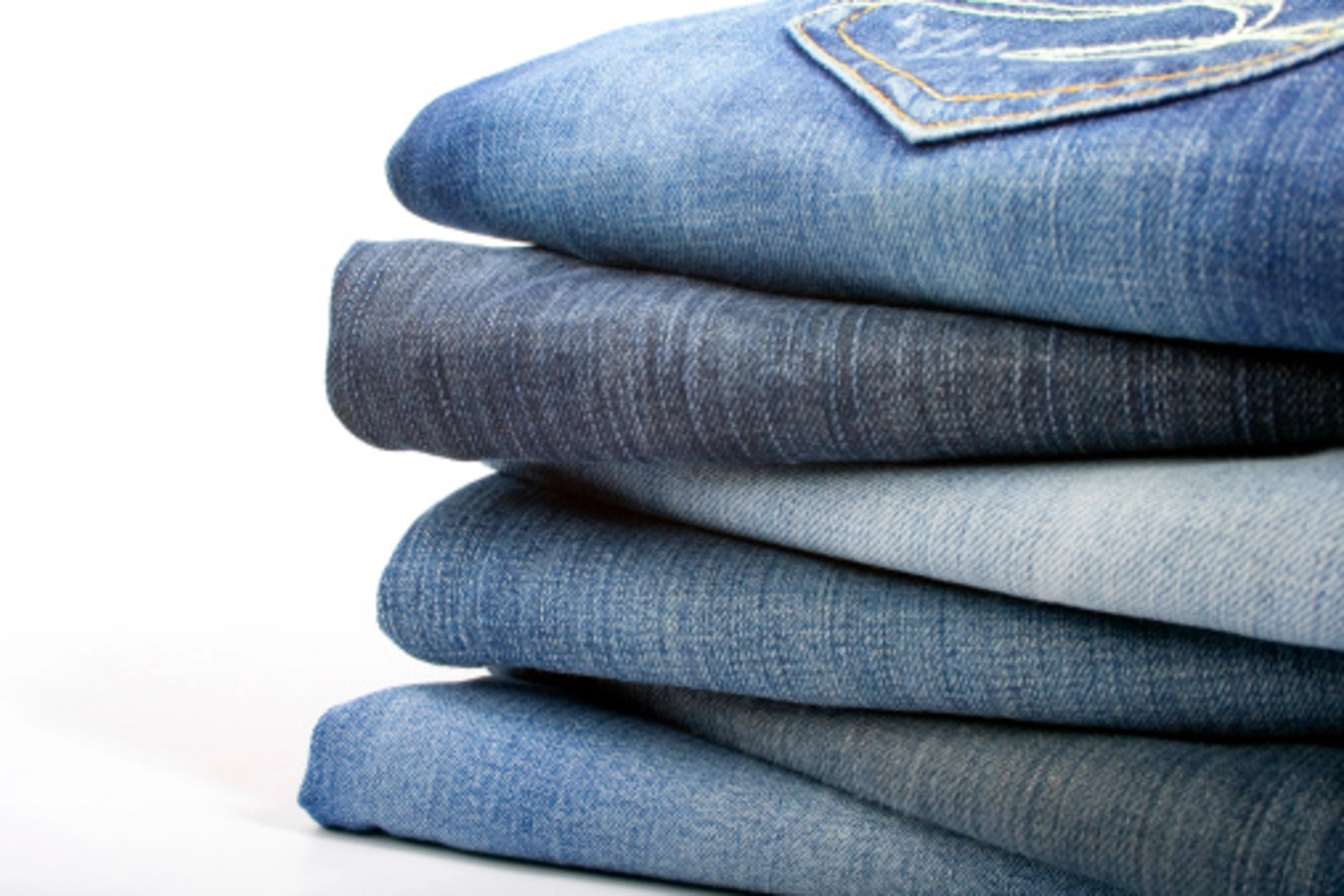 stack of blue jeans