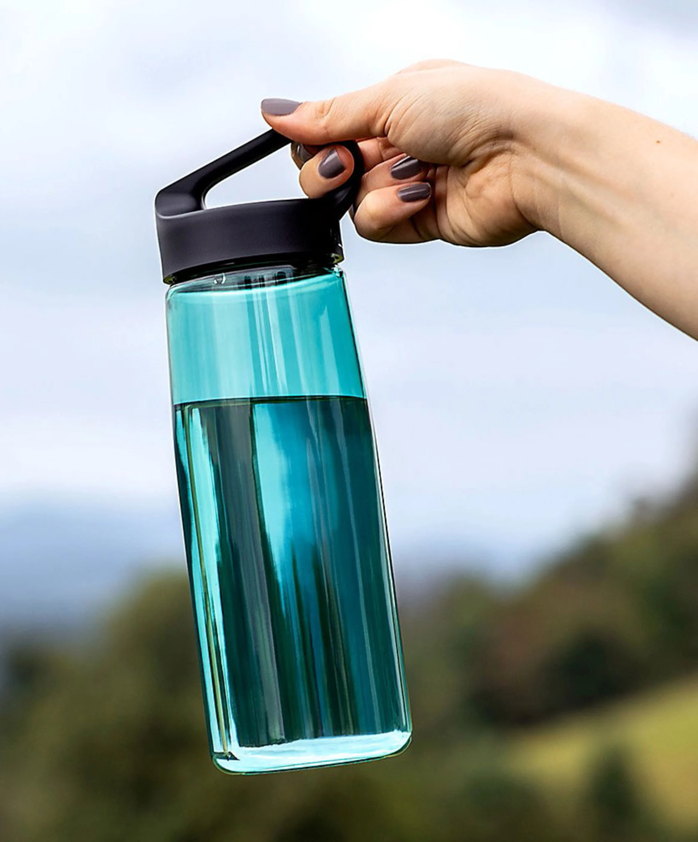 Man drinking from Tritan sports bottle