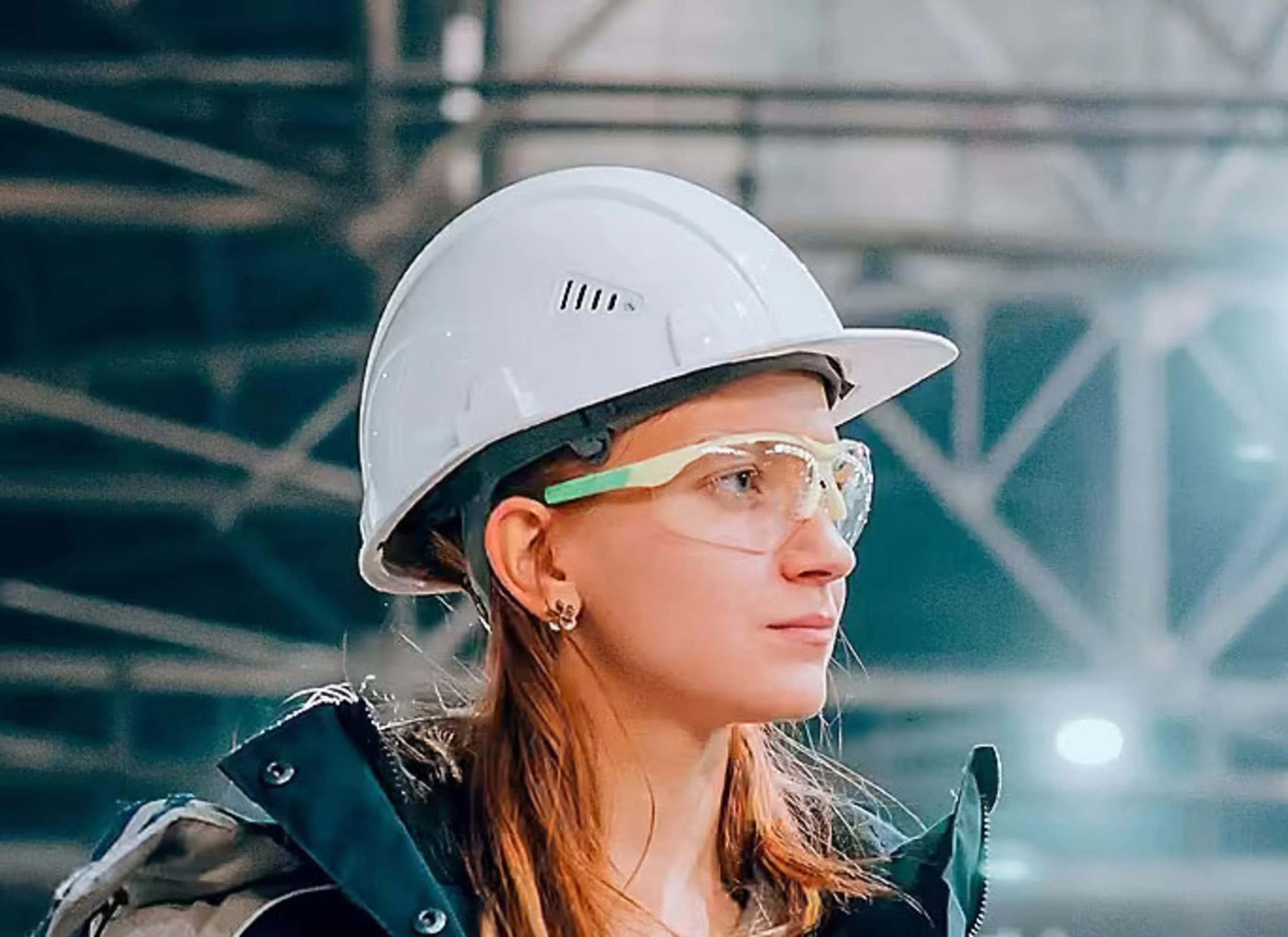 Woman in safety glasses and hard hat