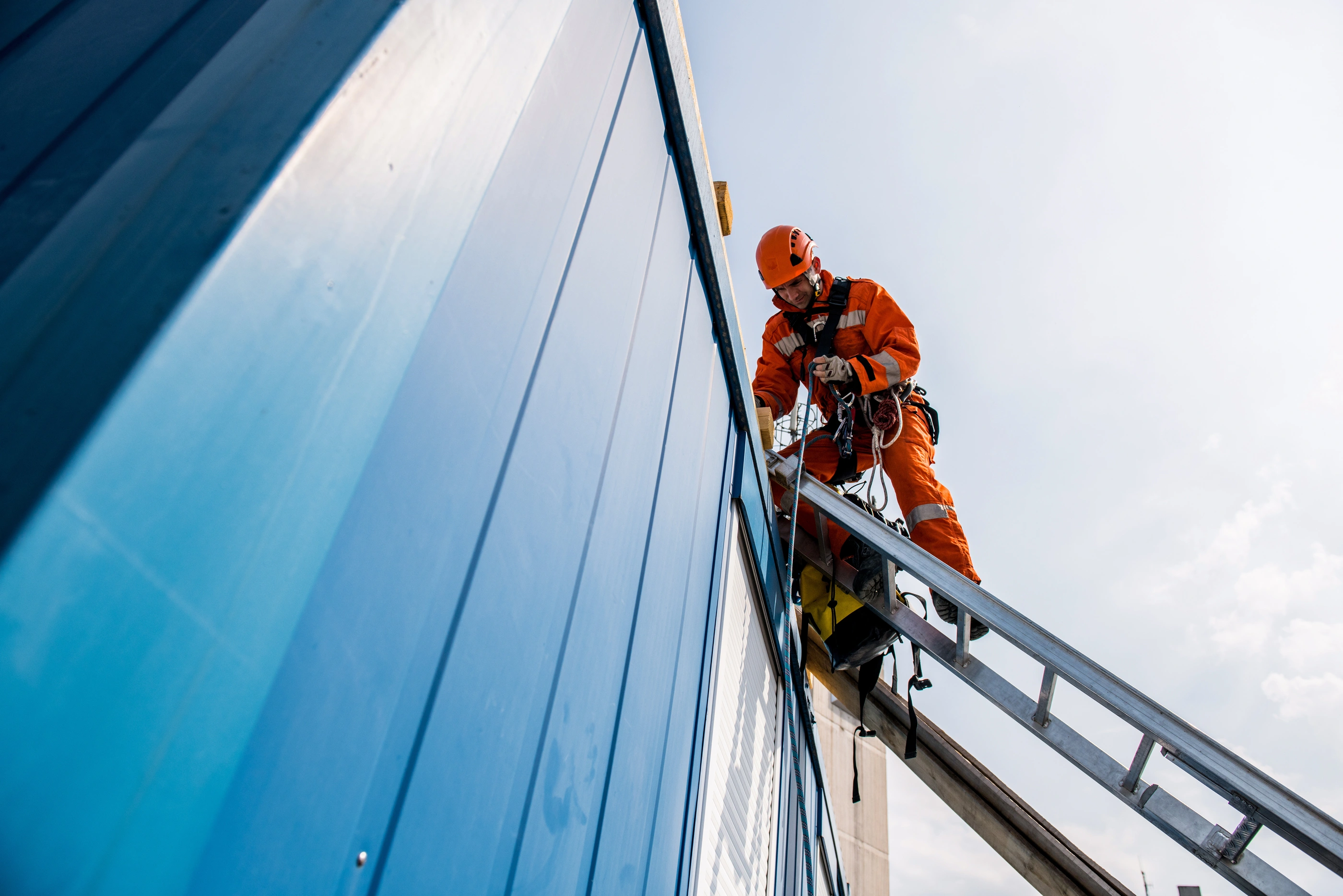 Firefighters in a rescue operation - accident on the roof.