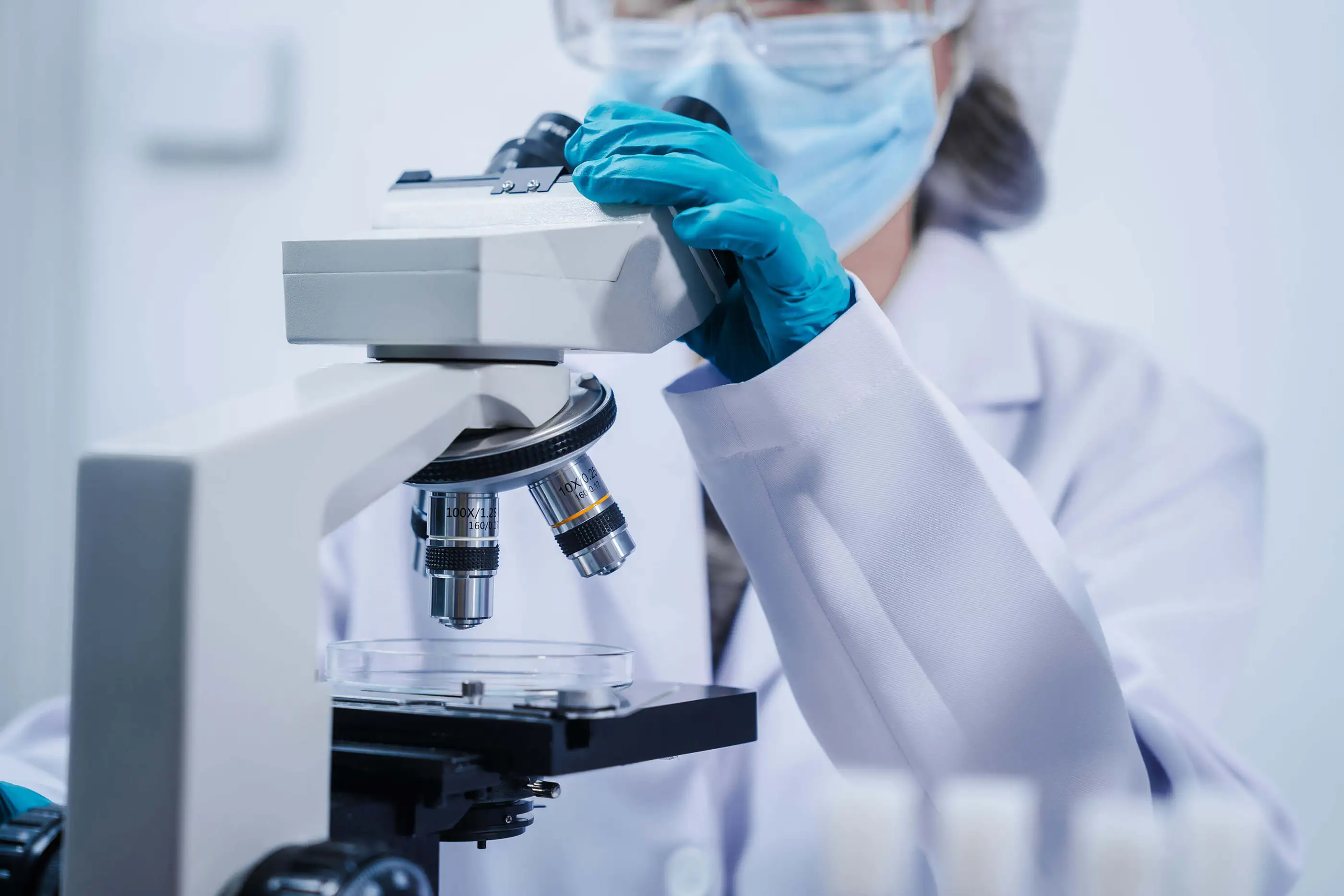 Scientist with a microscope