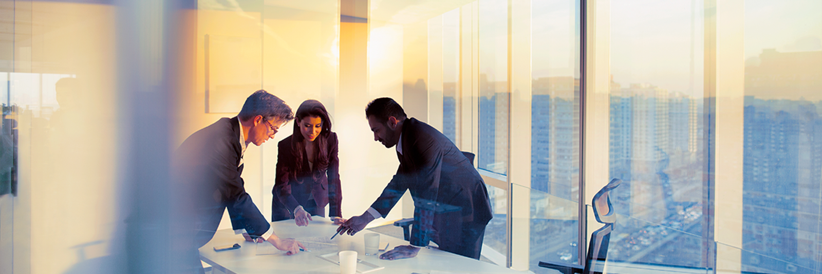 Business colleagues planning together in meeting.