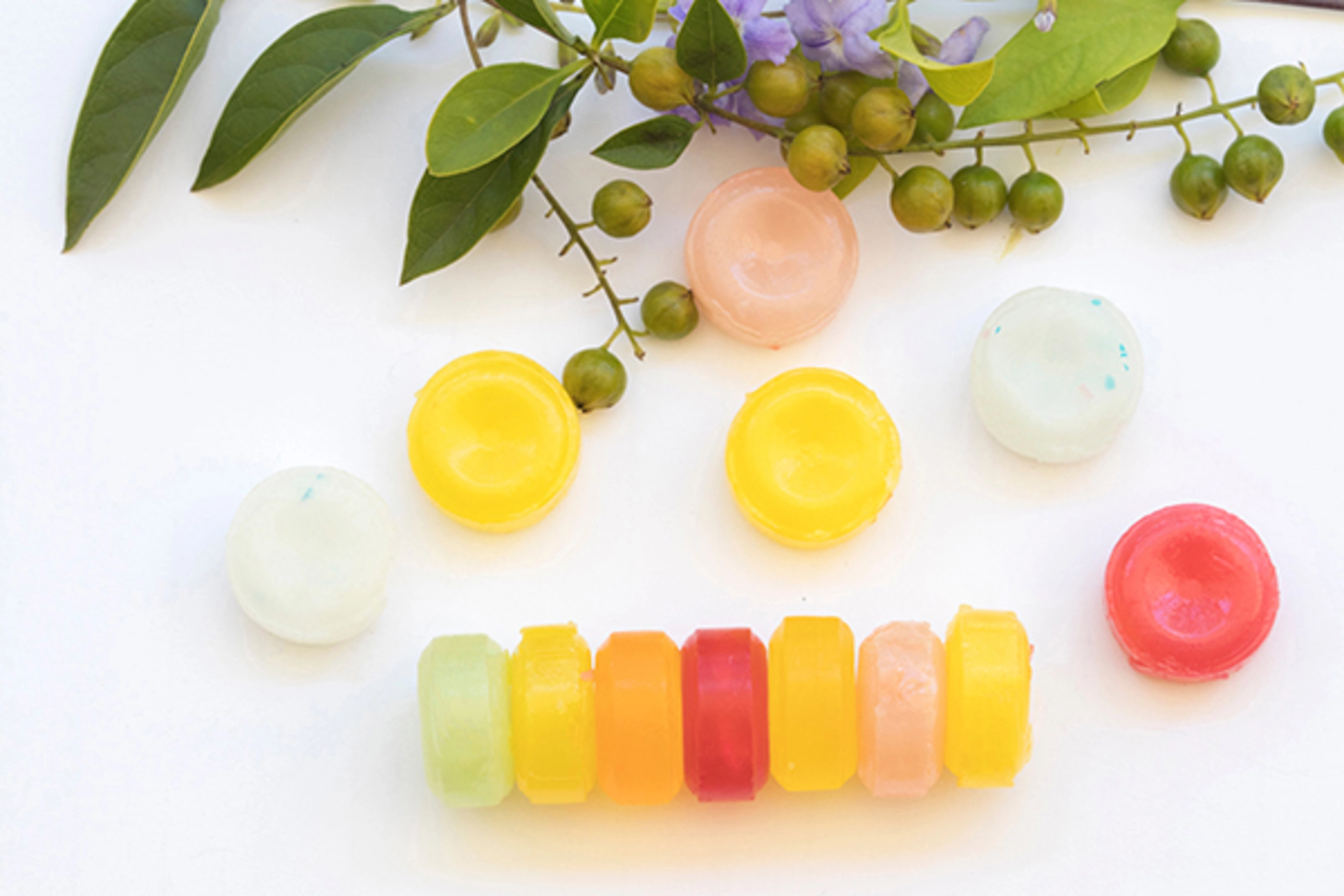 cough sore throat pastille pills from herbal arrangement on background white