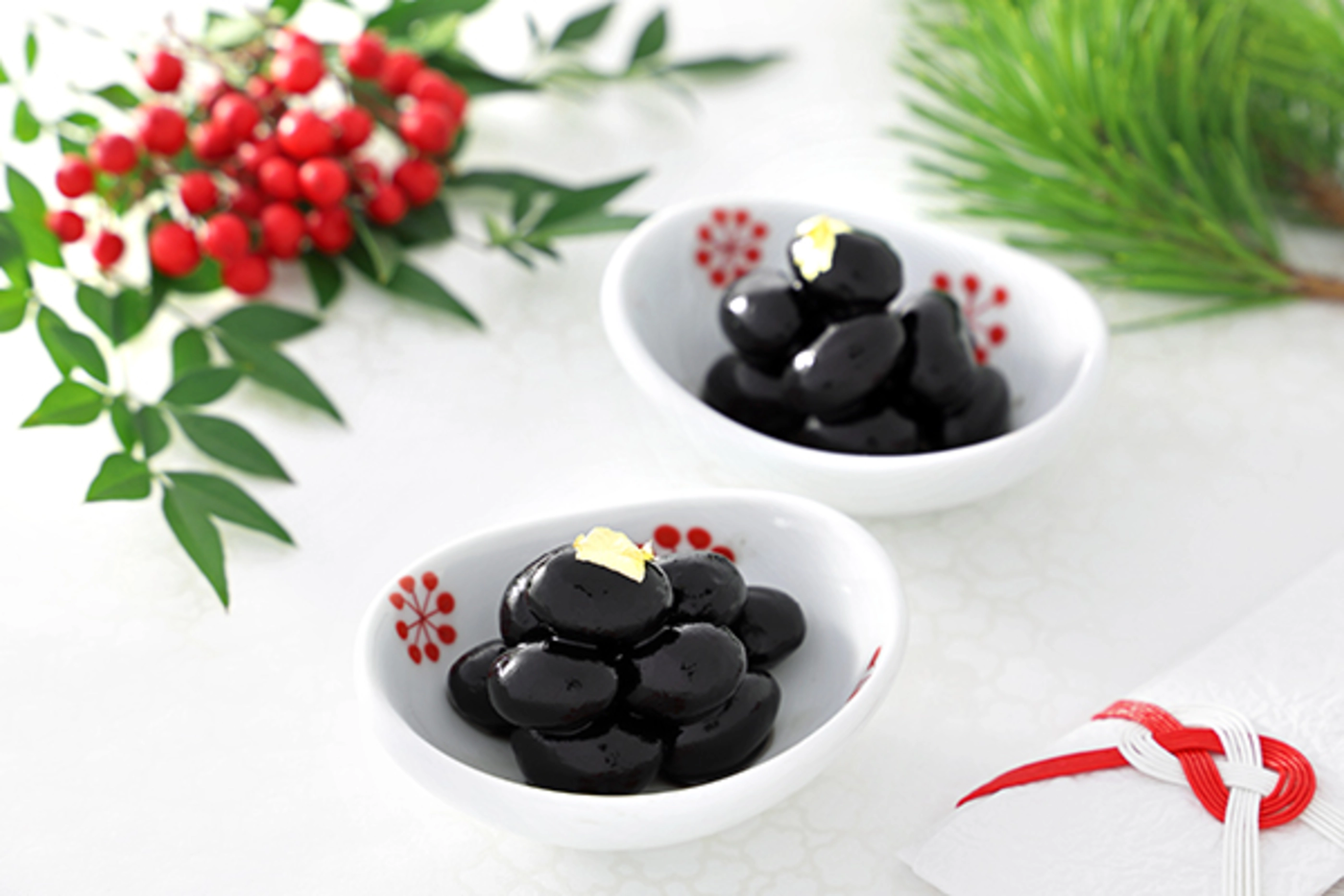 Home made simmered black soy beans on small bowl.