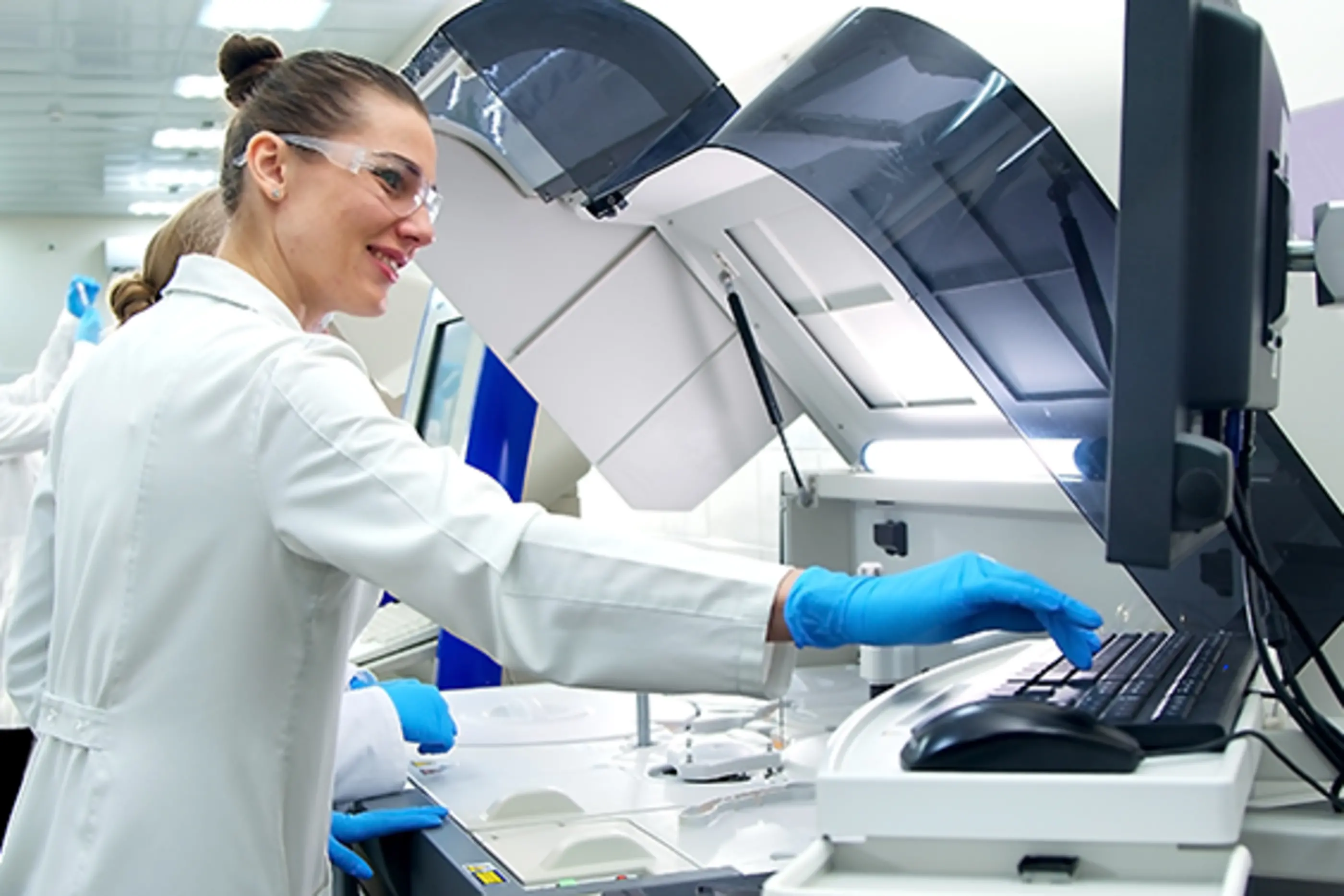 scientist entering data in computer