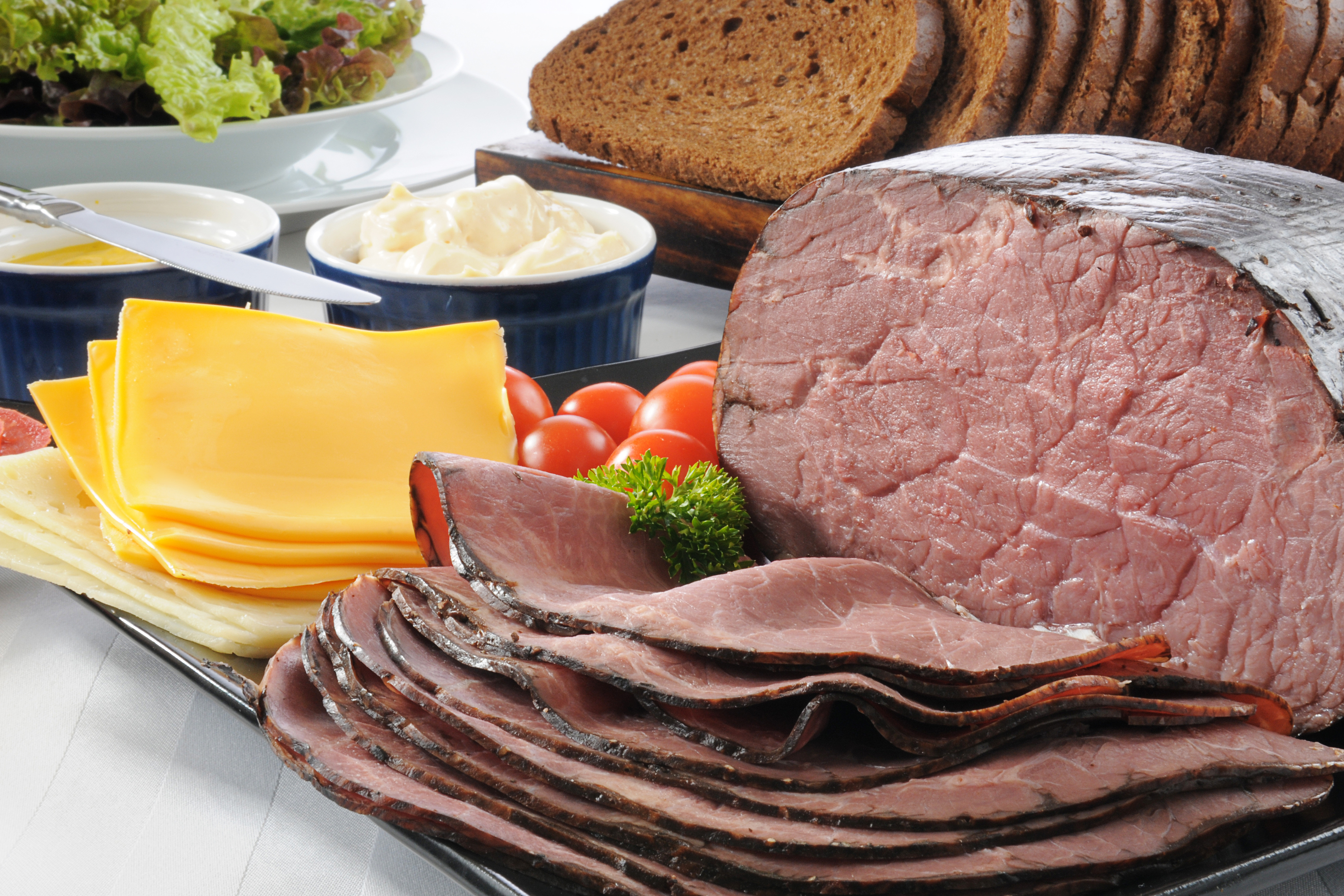 A sliced roast beef sandwich buffet