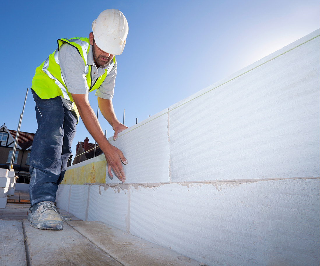 50-50 Bricklayer working on construction site.